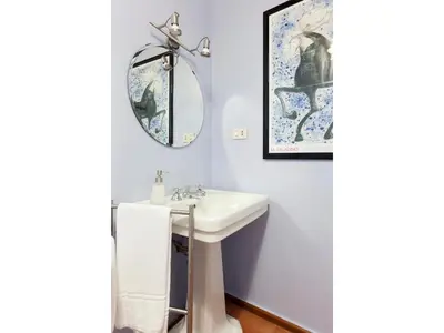 a bathroom with a sink and a mirror at Apartment Via Farina in Rome