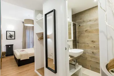 a bathroom with a sink and a mirror at Thebestinrome Vite in Rome