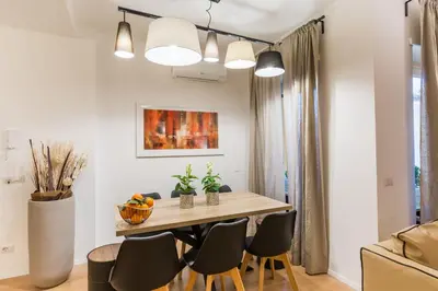 a dining room with a table and chairs at Thebestinrome Vite in Rome