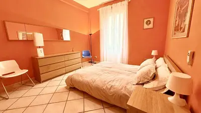a bathroom with a toilet and a sink and a tub at Modì Apartment in Rome