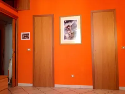 a kitchen with white cabinets and a stove at Modì Apartment in Rome