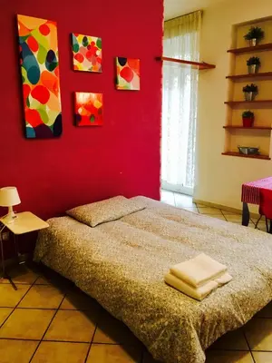 two pictures of a bathroom with a sink and a toilet at Modì Apartment in Rome