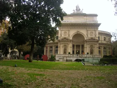 a large building with a statue in front of it at Domus Eugenia in Rome