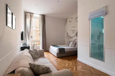 a living room with a bed and a couch at Vanity Navona in Rome