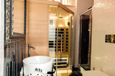 a bathroom with a tub and a glass shower at Two Chic Guesthouse in Rome
