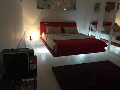 a bedroom with a bed and a tv in it at Two Chic Guesthouse in Rome