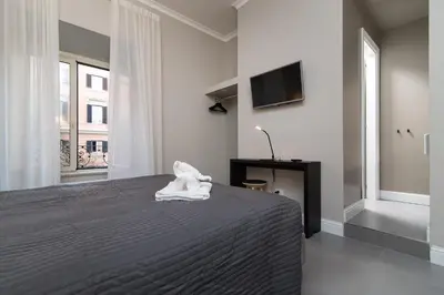 a bedroom with a bed with a towel on it at Ovidio Suite in Rome
