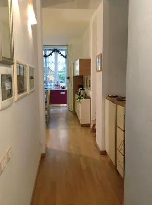 a hallway of a apartment with a kitchen at Viadelloca35 in Rome