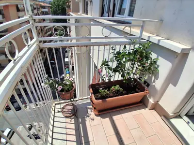 a balcony with two potted plants on a railing at Monnalisa Home in Rome