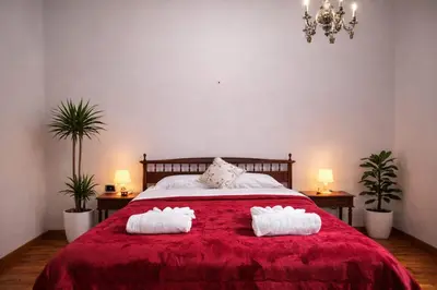 a bedroom with a large white bed and two lamps at EXCELLENT Palace in Rome