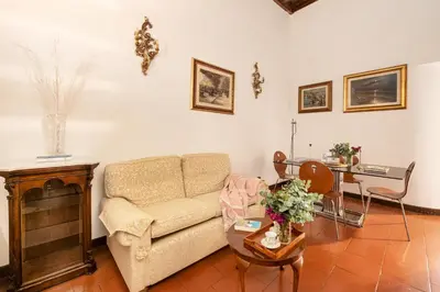 a living room with a couch and a table at Annemary Maison in Rome