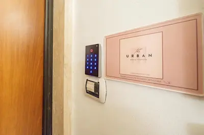 a door with a sign that reads urem on it at BHM Urban House Pigneto in Rome