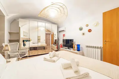 a room with a bed with two towels on it at BHM Urban House Pigneto in Rome