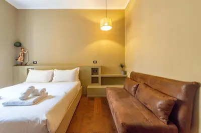 a hallway with an open door and a bathroom at Residenza Pasolini in Rome