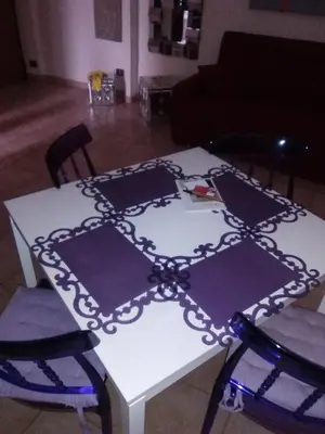a white table with a black pattern on it at A.B Battistini Short Let's in Rome