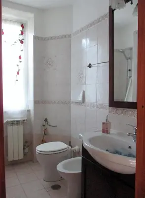 a bathroom with a toilet and a sink at A.B Battistini Short Let's in Rome