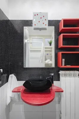 a bathroom with a red toilet on a red counter at B&B Ibiscus in Rome