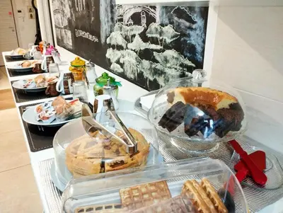 a buffet of food on a table with food at Coffee And The City in Rome