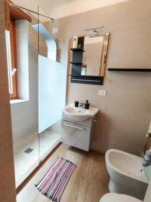a bathroom with a sink and a toilet and a mirror at Coffee And The City in Rome