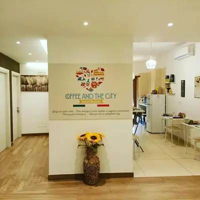 a wall with a sign that says gift and the city at Coffee And The City in Rome