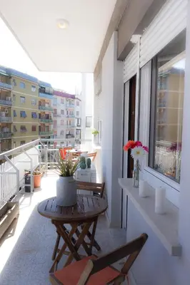 a balcony with a table and chairs on a building at Coffee And The City in Rome