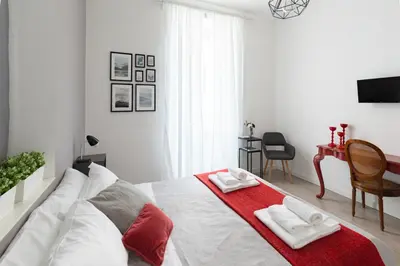 a bedroom with a bed with two towels on it at A+ Bed and Breakfast in Rome
