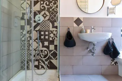 a bathroom with a shower and a sink at A+ Bed and Breakfast in Rome