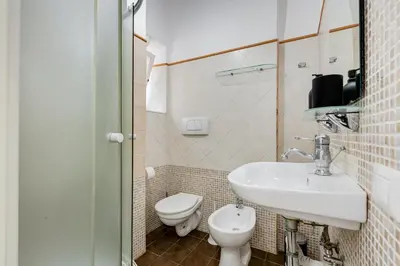 a bathroom with a sink and a toilet at BDC - The Choice, your 2-Bdr apt in Vatican district in Rome