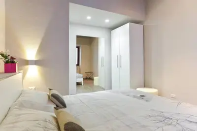 a bedroom with a large bed in a room at Navona Rubens Lodge in Rome