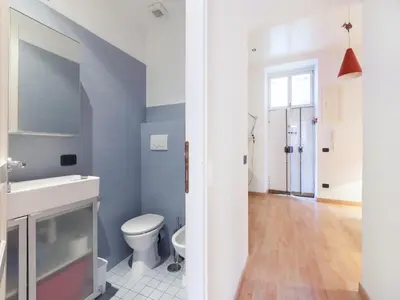 a bathroom with a toilet and a sink at Sabelli Nightlife Apartment-LA SAPIENZA-TERMINI STATION in Rome