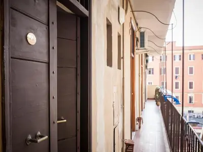 an empty hallway with a black door on a building at Sabelli Nightlife Apartment-LA SAPIENZA-TERMINI STATION in Rome