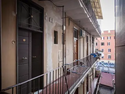an empty balcony with a black door on a building at Sabelli Nightlife Apartment-LA SAPIENZA-TERMINI STATION in Rome