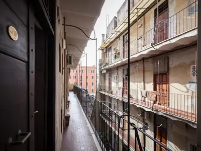 an empty hallway of an apartment building with balconies at Sabelli Nightlife Apartment-LA SAPIENZA-TERMINI STATION in Rome