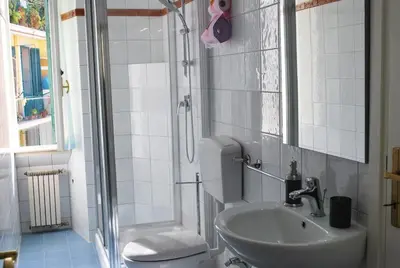 a bathroom with a toilet and a sink and a shower at San Peter's Corner in Rome