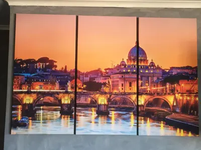 a painting of a bridge over a river with a city at Casetta Fleming in Rome