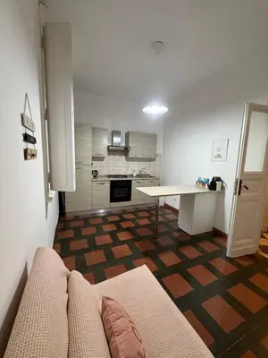 a living room with a couch and a table at St. John Apartment in Rome