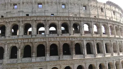an image of the colosseum building at St. John Apartment in Rome