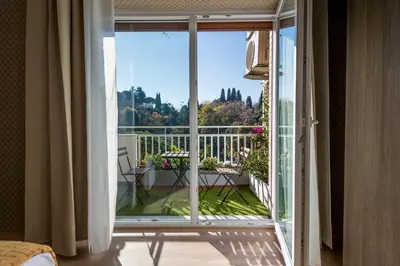 a room with a sliding glass door to a balcony at Happy Holiday in Rome b&b in Rome