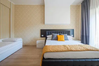 a bedroom with a large bed and a window at Happy Holiday in Rome b&b in Rome