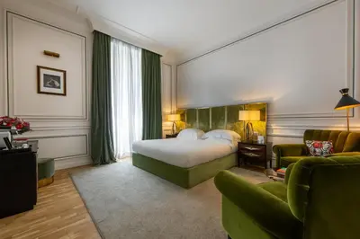 a hotel room with a bed and a couch at Palazzo Dama - Hotel & SPA - Preferred Hotels & Resorts in Rome