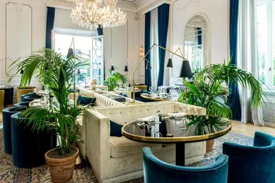 a living room with a couch and tables and plants at Palazzo Dama - Hotel & SPA - Preferred Hotels & Resorts in Rome