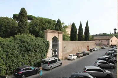a bunch of cars parked on the side of a street at Domus al Palatino in Rome