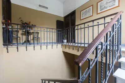 a staircase with a purple railing in a room at Domus al Palatino in Rome