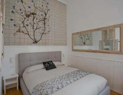 a bedroom with a bed and a window at Primo Piano Suites in Rome