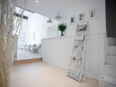 a room with a ladder and a white wall at Primo Piano Suites in Rome