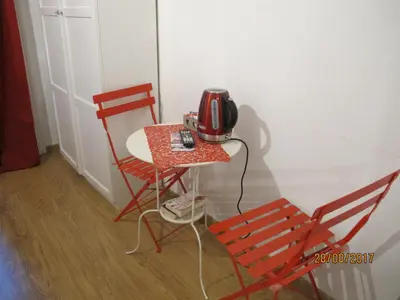 a telephone sitting on a table next to a chair at TuttoTondo Roma in Rome