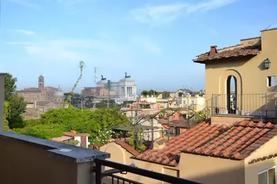 a view of a city from the balcony of a building at Studio Cardello Colosseum in Rome