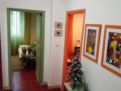 a hallway with a christmas tree in a room at Le Tre Sorelle B&b Garbatella in Rome