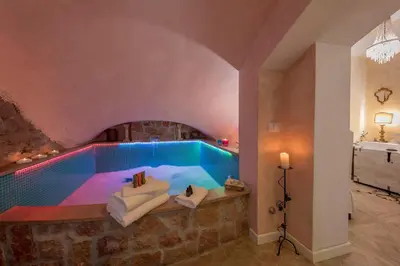 a pool in the middle of a room at St.Peter's Mirror - Romantic View in Rome