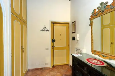 a bathroom with a sink and a mirror at Appartamento Sforza a Monti in Rome